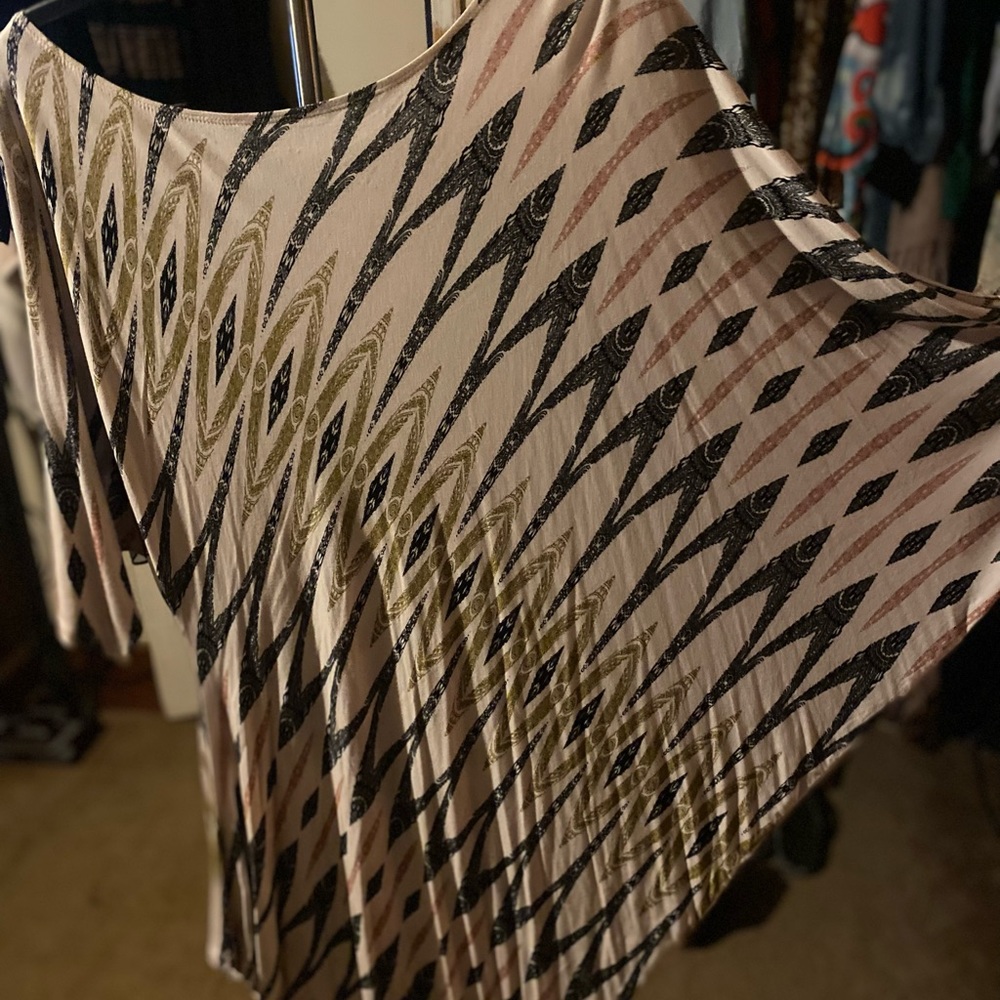 Cute asymmetrical Jennifer Lopez dress.